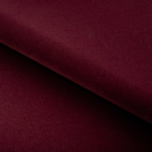 Close-up of a burgundy fabric with a diagonal fold