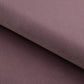 Close-up of a textured purple fabric with a diagonal fold.