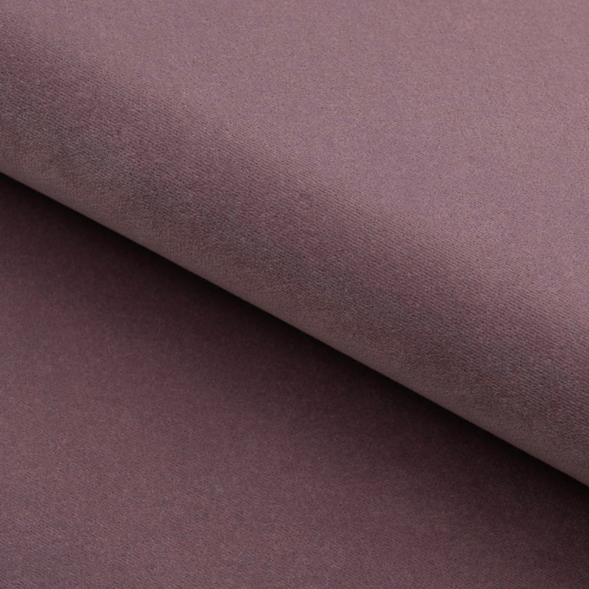 Close-up of a textured purple fabric with a diagonal fold.