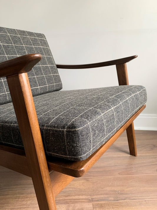 Windowpane Check fabric cushions sitting on an MCM wooden Chair frame.